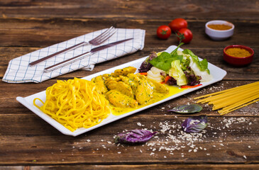 Fried chicken and pasta with sauce, prepared with special ingredients