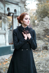 Portrait of a grieving woman  on the background of the Crypt.