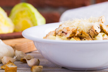 A vegetarian caesar salad made with special ingredients, fresh greens and grilled chicken