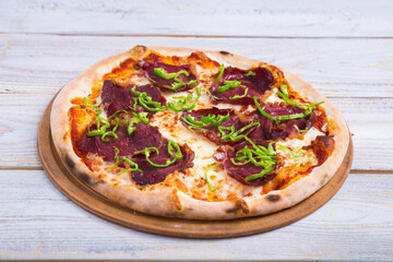 The pizza is prepared with special ingredients. delicious fresh-from-the-oven snack