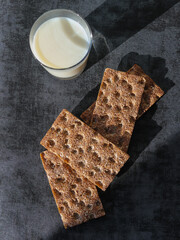 Whole grain rye crispbreads and glass of milk