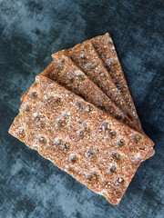 Wholegrain rye crispbreads on dark background