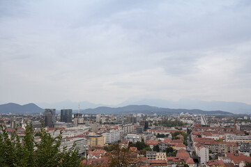Panoramic view of Downtown Ljubljana, Slovenia taken from above during a cloudy grey sky afternoon seen from above with residential towers. Ljubljana is the biggest city and the capital of Slovenia...