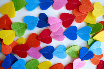Colored hearts on a white background. Valentine's Day concept. Place for text and background texture. Colorful love