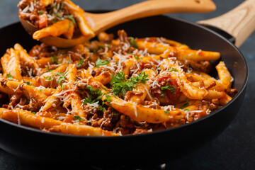 Maccheroni al ferretto with beef in ragu bolognese. Front view.