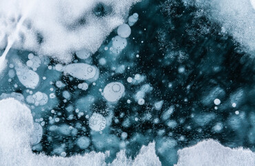 Clear ice and bubbles - frozen Baikal lake at winter