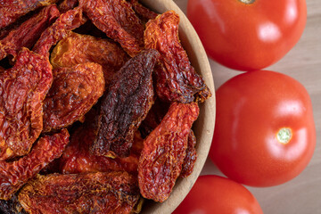 Fresh tomatoes and sun-dried tomatoes top view