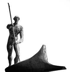 Charon ferryman of souls in the world of the dead. Black and white image. Ancient statue isolated...