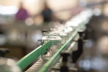 Empty glass jars ready for canning. Food industry background. Preservation of vegetables. An...