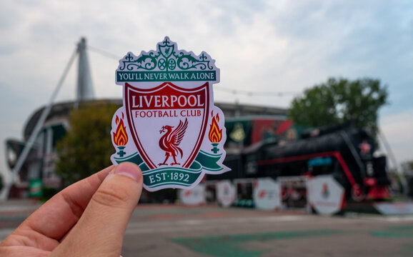 August 30, 2021, Liverpool, UK. Liverpool F.C. Football Club emblem against the backdrop of a modern stadium.