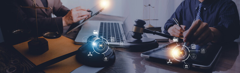 Male lawyer working with contract papers and wooden gavel on tabel in courtroom. justice and law ,attorney, court judge, concept.