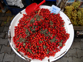  Hawthorn berries on a farmers market stall in the Aegean town Yalikavak in Bodrum, Turkey. On the...