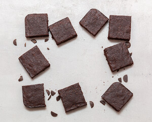 Slices of brownie dessert on a light background

