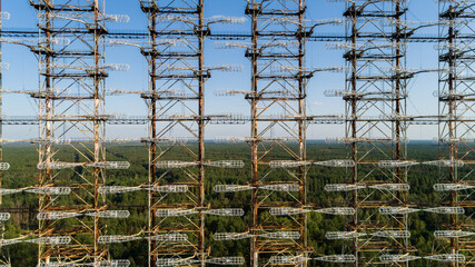 Close up aerial view of the DUGA radar station near the city of Chernobyl-2 among the forest in...