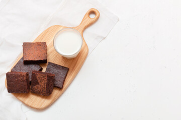 Slices of brownie dessert on a light background
