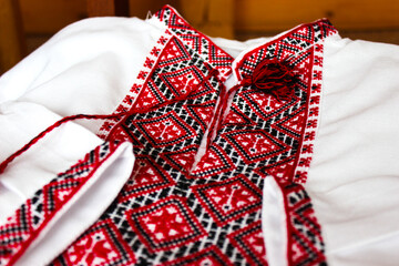 Vyshyvanka - national Ukrainian clothes. Embroidery with red and black threads on white fabric