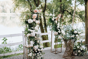 Decor for a wedding ceremony. Arch of fresh flowers