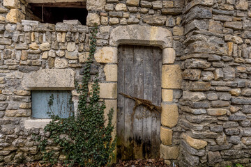 Old wooden gate in the medieval village of Rochecolombe in Ardèche, France
