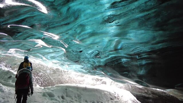 Ice Cave in Vatnajokull, Iceland.The beauty of the caves filled with blue ice. 