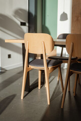 Stylish Scandinavian interior in a country house (barnhouse). Dining area, chairs, set.