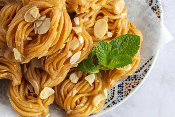 Homemade chebakias pastries, typical Moroccan sweets with honey