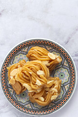 Homemade chebakias pastries, typical Moroccan sweets with honey