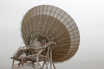 satellite dish radar antenna station in field. parabolic antennas. Big parabolic antenna against...