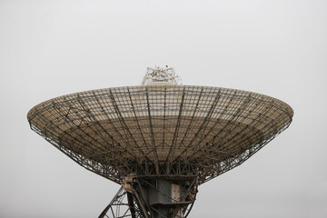 satellite dish radar antenna station in field. parabolic antennas. Big parabolic antenna against sky. Satellite dish at earth station with a sky.