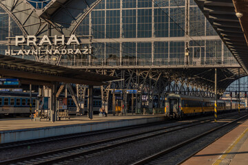 Fototapeta na wymiar Prague main station in sunny winter evening with trains