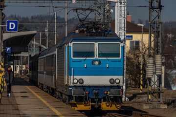 Zabreh station with passenger and cargo trains in sunny day