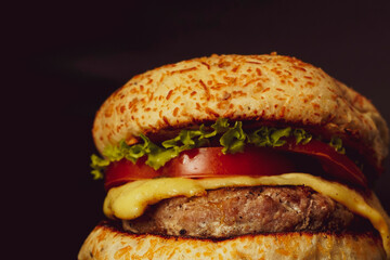 Fresh hamburger on black background