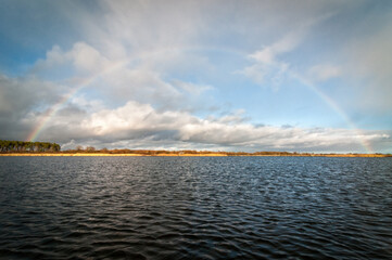 Rainbow over the swedish sea bay