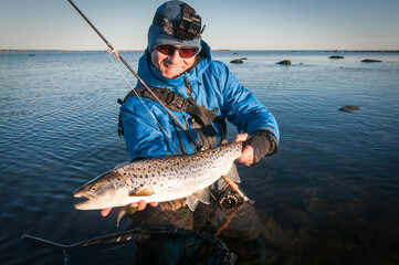 Happy angler with nice size seatrout