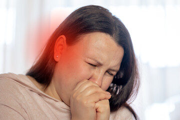 Young woman suffering of tinnitus disease, insomnia or stress concept, sick female having ear pain touching her painful head, healthcare concept