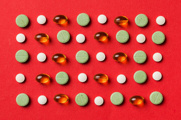 Many different pills and space for text on colorful background, top view. Different pills on color background, flat lay