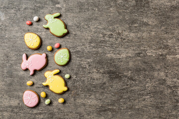 holiday preparation Multi colors Easter eggs with cookies on colored background . Pastel color Easter eggs. holiday concept with copy space