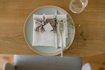Coziness and style. Modern event design. Table setting at wedding reception. Floral compositions...