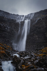 Fossa Waterfall on island Bordoy. This is the highest waterfall in the Faroe Islands, situated in wild scandinavian scenery. November 2021