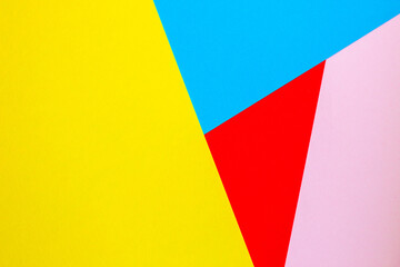 Abstract background with colored paper blue yellow red color.