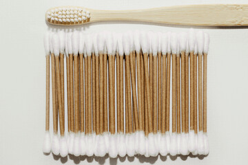 Eco-friendly bamboo cosmetic cotton buds with wooden toothbrush.