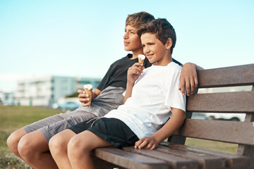 You cant be sad when youre eating ice-cream. Shot of two happy brothers eating ice-cream cones...