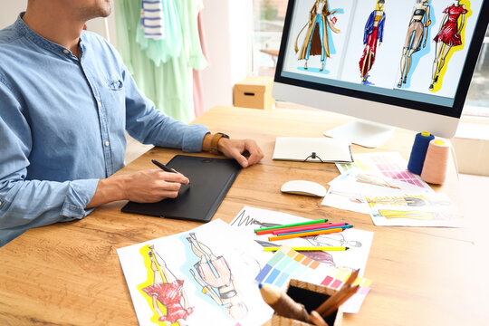 Male Fashion Designer Working In Studio