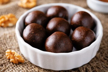 Dates walnuts chocolate raw balls in a plate