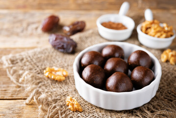 Dates walnuts chocolate raw balls in a plate