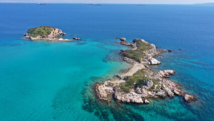 Fototapeta na wymiar Aerial drone photo of small paradise tropical exotic islands covered in limestone with turquoise crystal clear sea