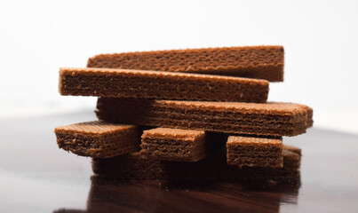 Pile of delicious chocolate wafers, on white background.