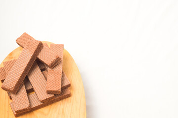 Pile of delicious chocolate wafers, on white background.