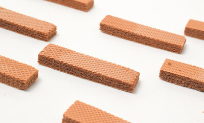 Pile of delicious chocolate wafers, on white background.