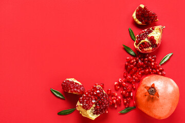 Tasty ripe pomegranate pieces on red background