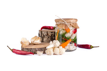 Cauliflower pickle with beetroot, marinated cauliflower pickle in jars with pepper and garlic on white background.
